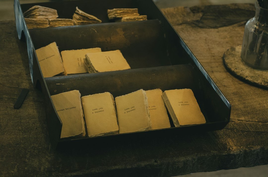 Stack of old documents and files on a wooden desk