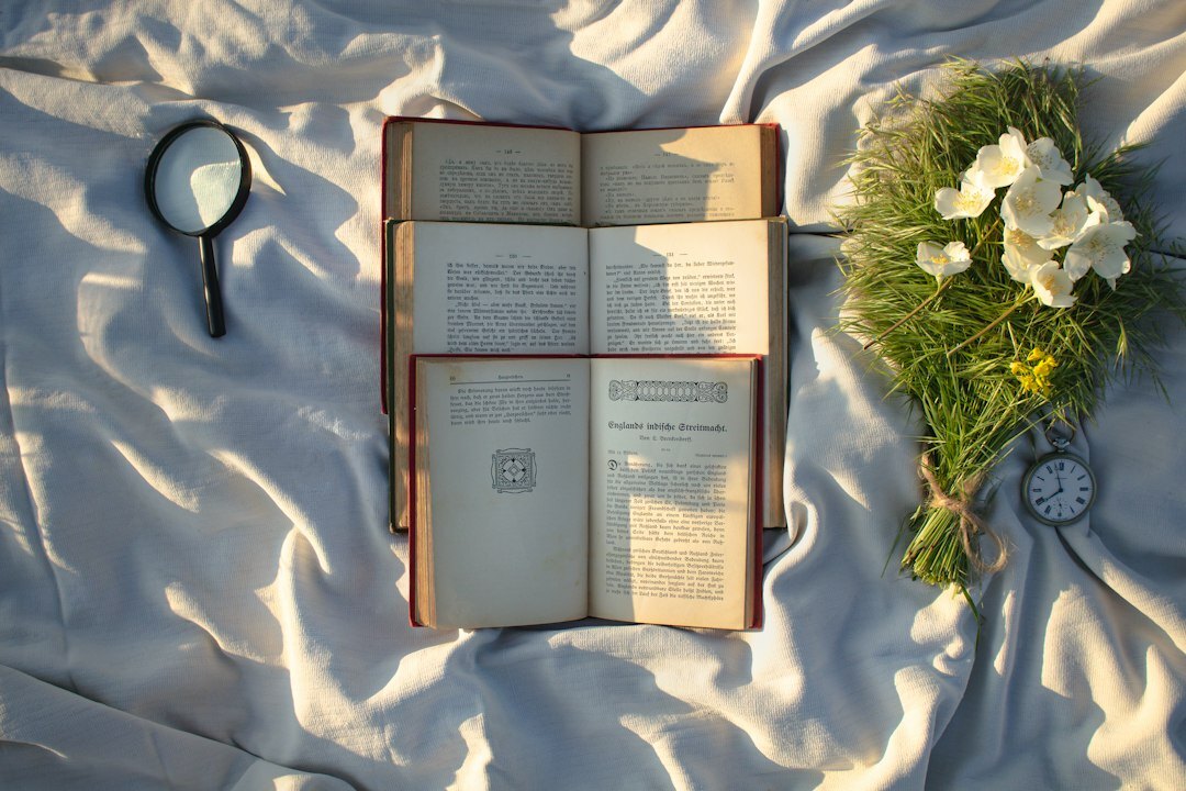Open book with a magnifying glass resting on the pages