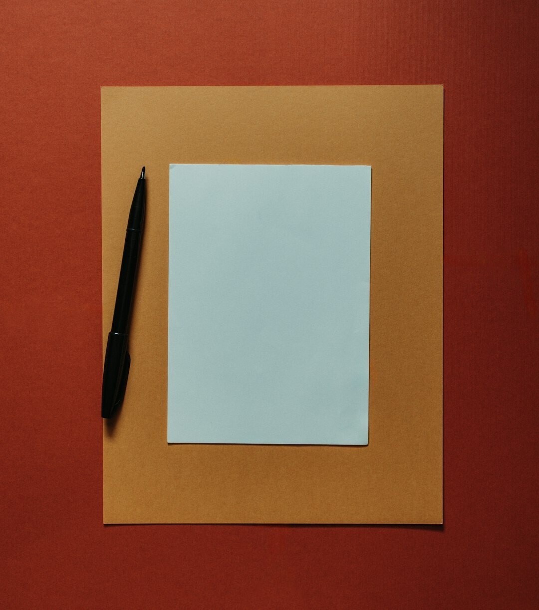 Stack of legal papers and a pen on a desk